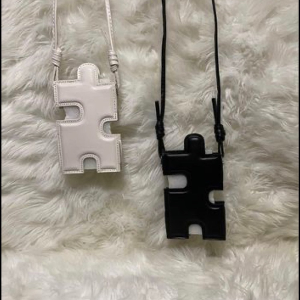 Puzzle piece cell phone holder